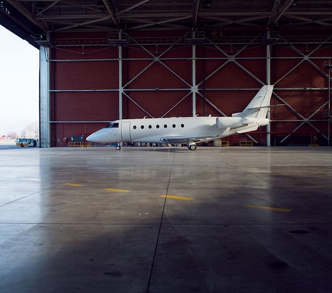 Business aircraft in an aviation hangar